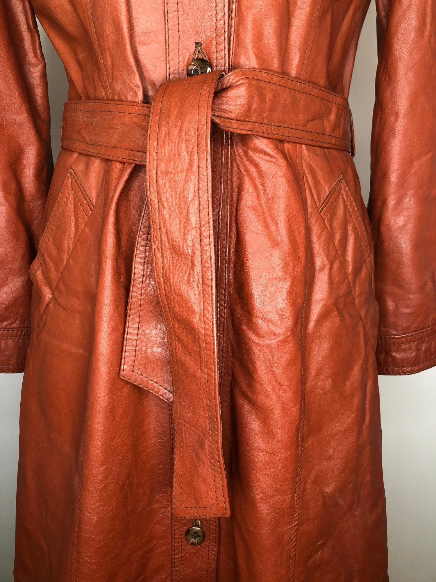 womens jacket  womens coat  womens  waist belt  vintage  Urban Village Vintage  urban village  trench  pockets  long length coat  long  lining  Leather Jacket  Leather  large pointed collar  Jacket  coat  button  brown  Belted waist  belted jacket  belt  70s  70  1970s  10