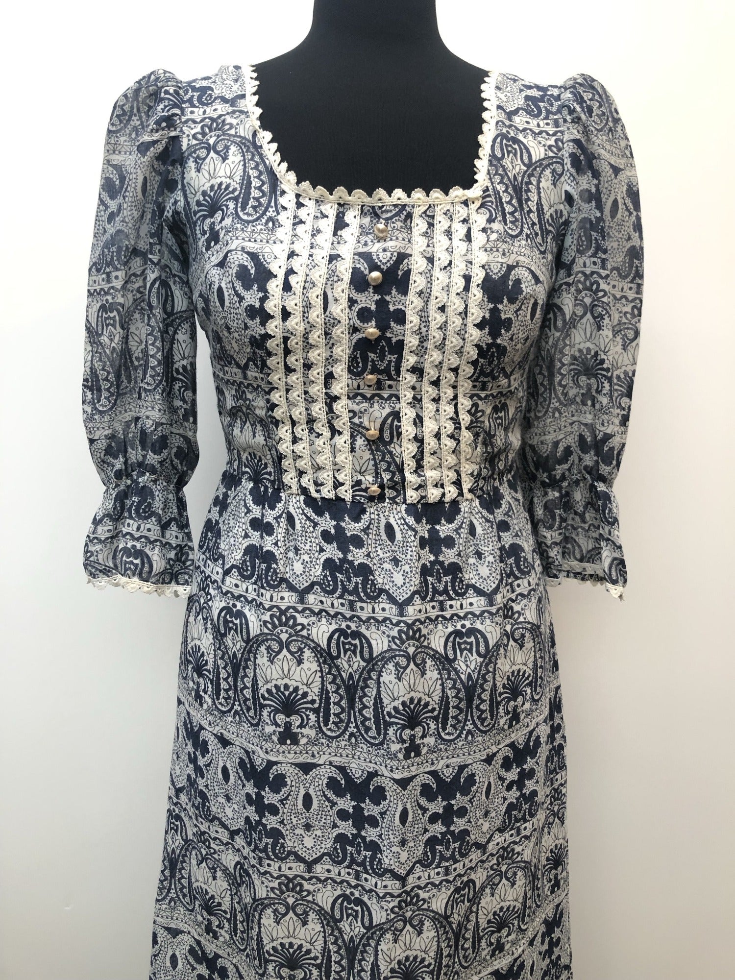 womens  white  vintage  Urban Village Vintage  summer dress  printed dress  pleat detail  maxi dress  long dress  ethnic print  decorative buttons  crochet trim  blue  8  70s  1970s
