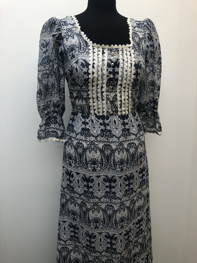 womens  white  vintage  Urban Village Vintage  summer dress  printed dress  pleat detail  maxi dress  long dress  ethnic print  decorative buttons  crochet trim  blue  8  70s  1970s