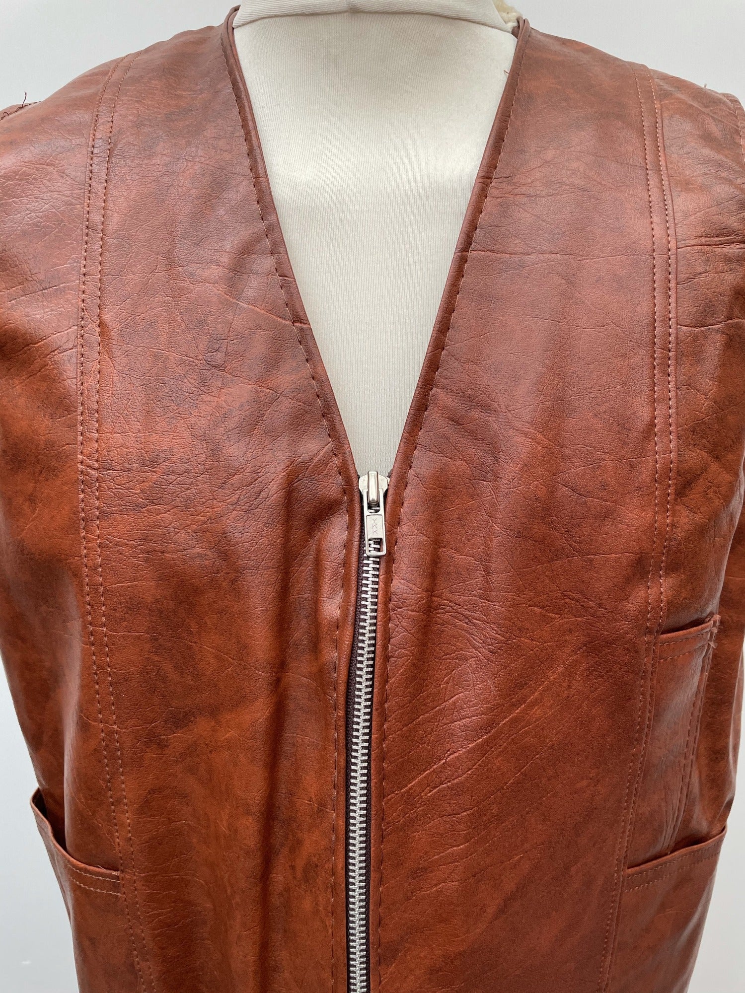 zip front  zip  waistcoat  Vinyl PVC  vintage  Urban Village Vintage  urban village  stitch detailing  stitch detail  sleevless  Sherpa  retro  PVC  polyester  pockets  mens  M  lined  light brown  Leather Jacket  Leather  Jacket  fully lined  fleece lined  Faux Leather  brown  70s  1970s
