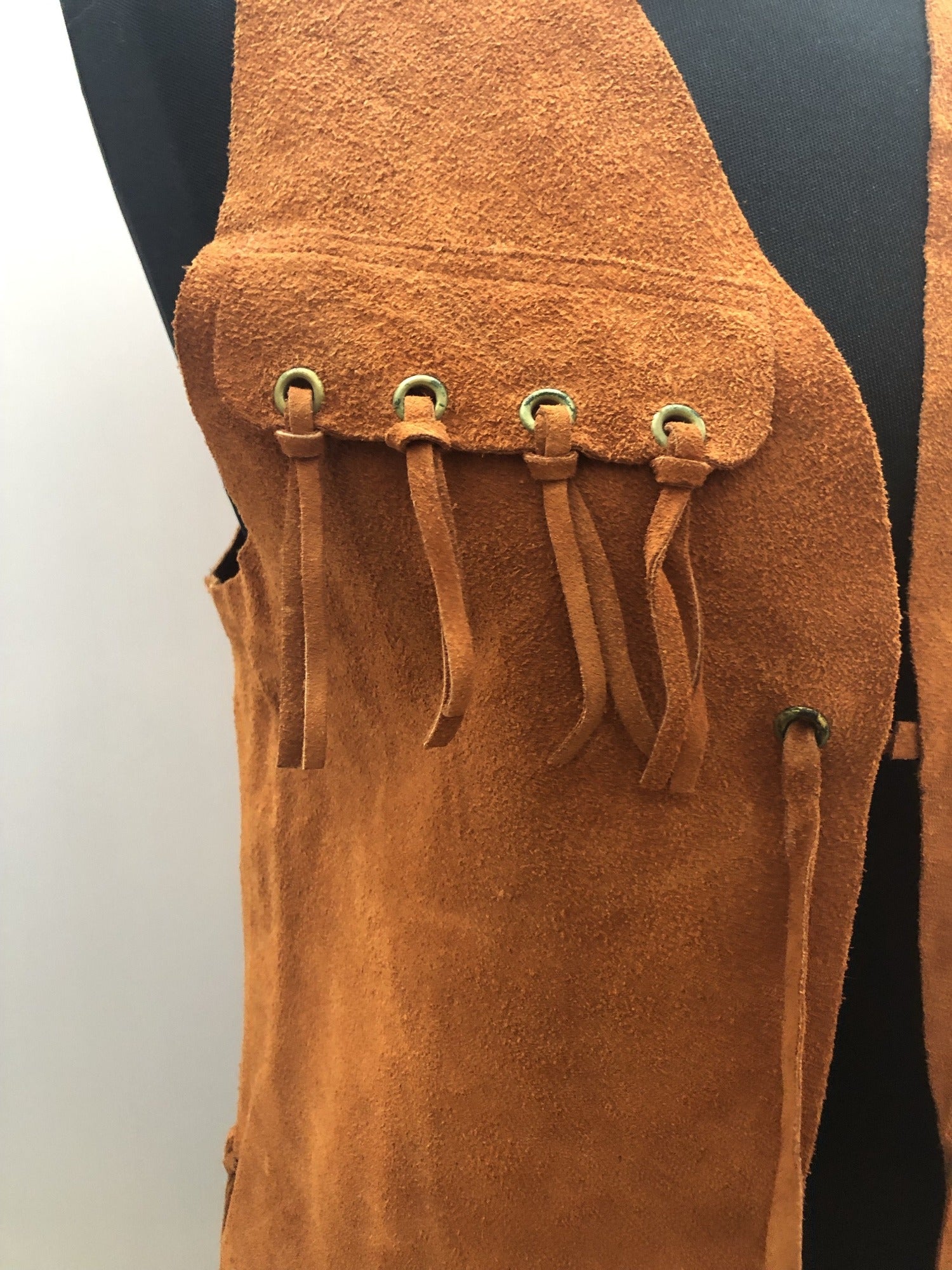 womens  vintage  Urban Village Vintage  urban village  Suede Jacket  suede fringing  Suede  stitch detailing  stitch detail  sleevless  retro  Jacket  fringing  fringed  fringe  festival  decorative pockets  coat  brown  boho  bohemian  70s  1970s  14