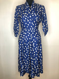 womens  vintage  v-neck dress  urban village  true vintage  three quarter sleeve  summer  side zip  rockabilly  print dress  polka dot print  pleated skirt  pleated  pleat detailing  pleat detail  pin up  fitted waist  dress  day dress  cross over front  Blue  Barbara  50s  1950s  14