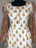 womens  vintage  Urban Village Vintage  retro  maxi dress  maxi  ethnic print  dress  decorative buttons  decorative bow  cream  brown  bell sleeve  8  70s  1970s