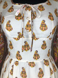 womens  vintage  Urban Village Vintage  retro  maxi dress  maxi  ethnic print  dress  decorative buttons  decorative bow  cream  brown  bell sleeve  8  70s  1970s