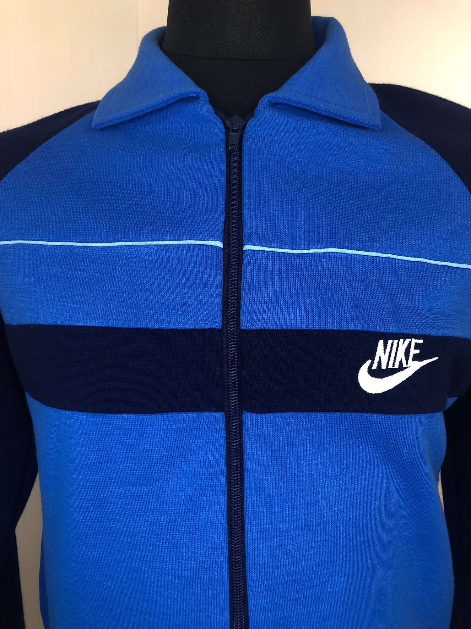 Nike blue tracksuit top hot sale