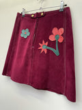 zip front  zip back  zip  womens  vintage  Urban Village Vintage  urban village  summer  Suede  stitch detailing  stitch detail  Skirts  skirt  retro  purple  press stud fastening  patchwork  Mini Skirt  mini  leather stitch  leather etching  Leather  floral print  floral  button down  8  70s  1970s
