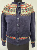 Womens original 1970s cardigan. Knitted material and patterned design with button fastening and round neck.