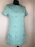 womens  vintage  Urban Village Vintage  round neck  psychedelic  patterned dress  patterned  MOD  mini dress  micro mini  lurex  gold lurex  floral dress  dress  decorative pockets  decorative buttons  blue  back zip  60s  1960s