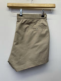 Mens original 1980s Fred Perry Sportswear shorts in tan. Zip fastening and waist button fastening adjustment with classic embroidered Fred Perry logo.