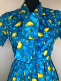 zip  womens  vintage  Urban Village Vintage  urban village  summer dress  side zip  shirt waist  sailor collar  print  pleat detail  floral dress  dress  bow tie collar  blue  50s  1950s  10