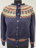 Womens original 1970s cardigan. Knitted material and patterned design with button fastening and round neck.